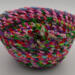 This view shows both the inside and outside of the basket with its big knot for embellishment.  This view shows both the inside and outside of the basket with its big knot for embellishment.